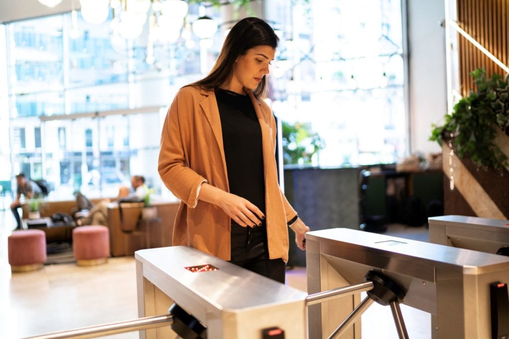 woman-going-through-access-control turnstile